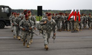 U.S. paratroopers from the U.S. Army's 173rd Infantry Brigade Combat Team based in Italy walk after unpacking as they arrive to participate in training exercises with the Polish army in Swidwin