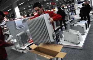 A vendor packs a heating appliance in a