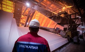 An employee stands beside stores of potassium chloride, also known as potash, at a storage plant operated by OAO Uralkali in Berezniki, Russia, on Friday, Aug. 23, 2013. Russia pressured Belarus to free Vladislav Baumgertner, the head of OAO Uralkali, the world's biggest potash producer, saying a refusal may harm relations as the smaller nation faces a funding crunch. Photographer: Andrey Rudakov/Bloomberg via Getty Images