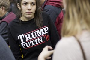 A woman wears a shirt reading 'Trump Putin '16' while waiting for Republican presidential candidate Donald Trump to speak at a campaign event at Plymouth State University Sunday, Feb. 7, 2016, in Plymouth, N.H. (AP Photo/David Goldman)